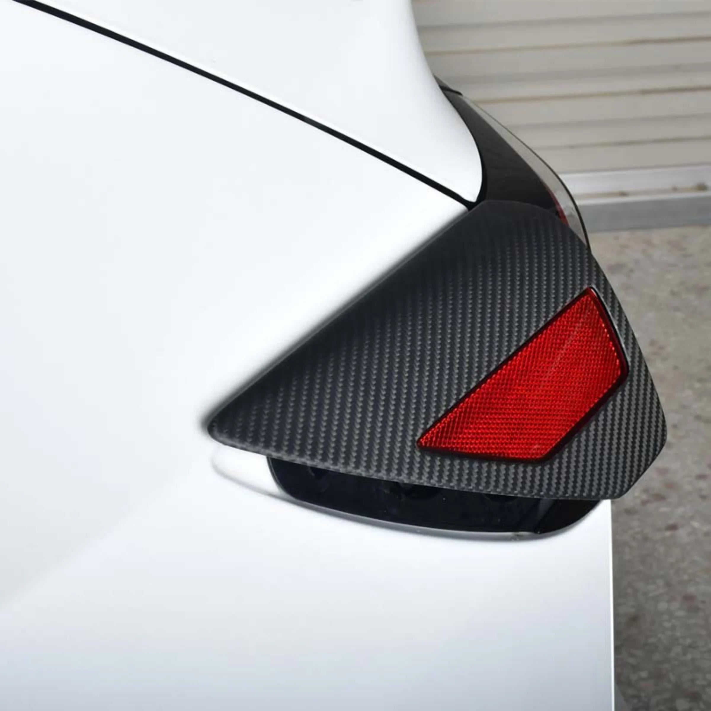 Premium carbon fiber finish on Tesla charging port protective cover
