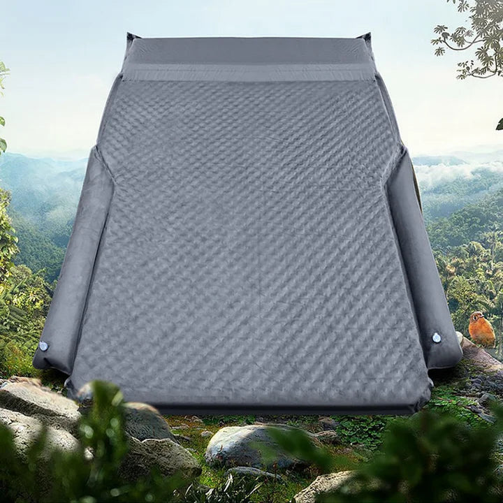 Inflating Tesla camping air mattress inside vehicle