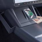 Tesla center console side organizer showing storage of phone and small items