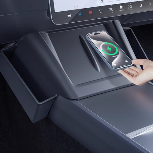 Tesla center console side organizer showing storage of phone and small items