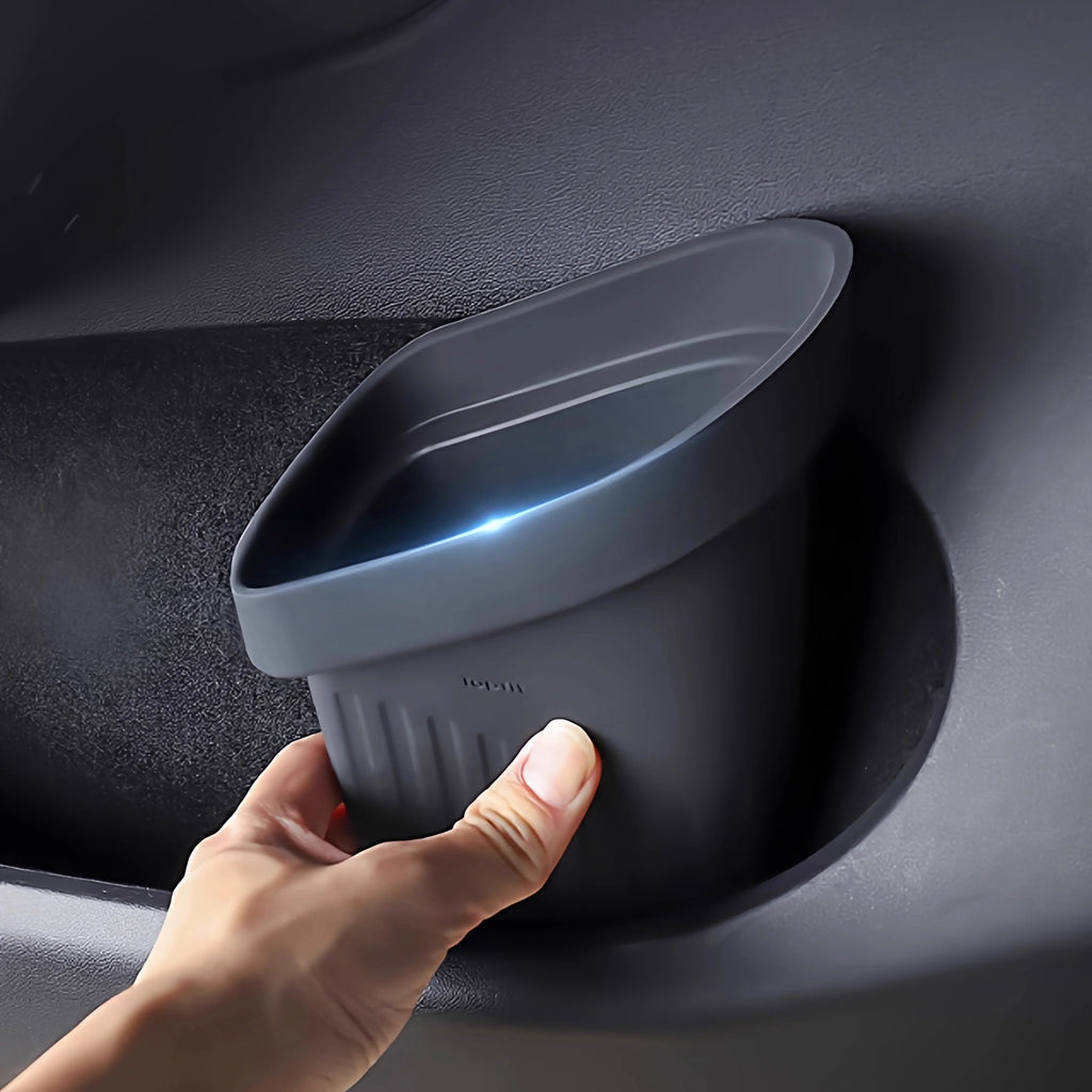 Tesla door storage organizer used as interior trash can