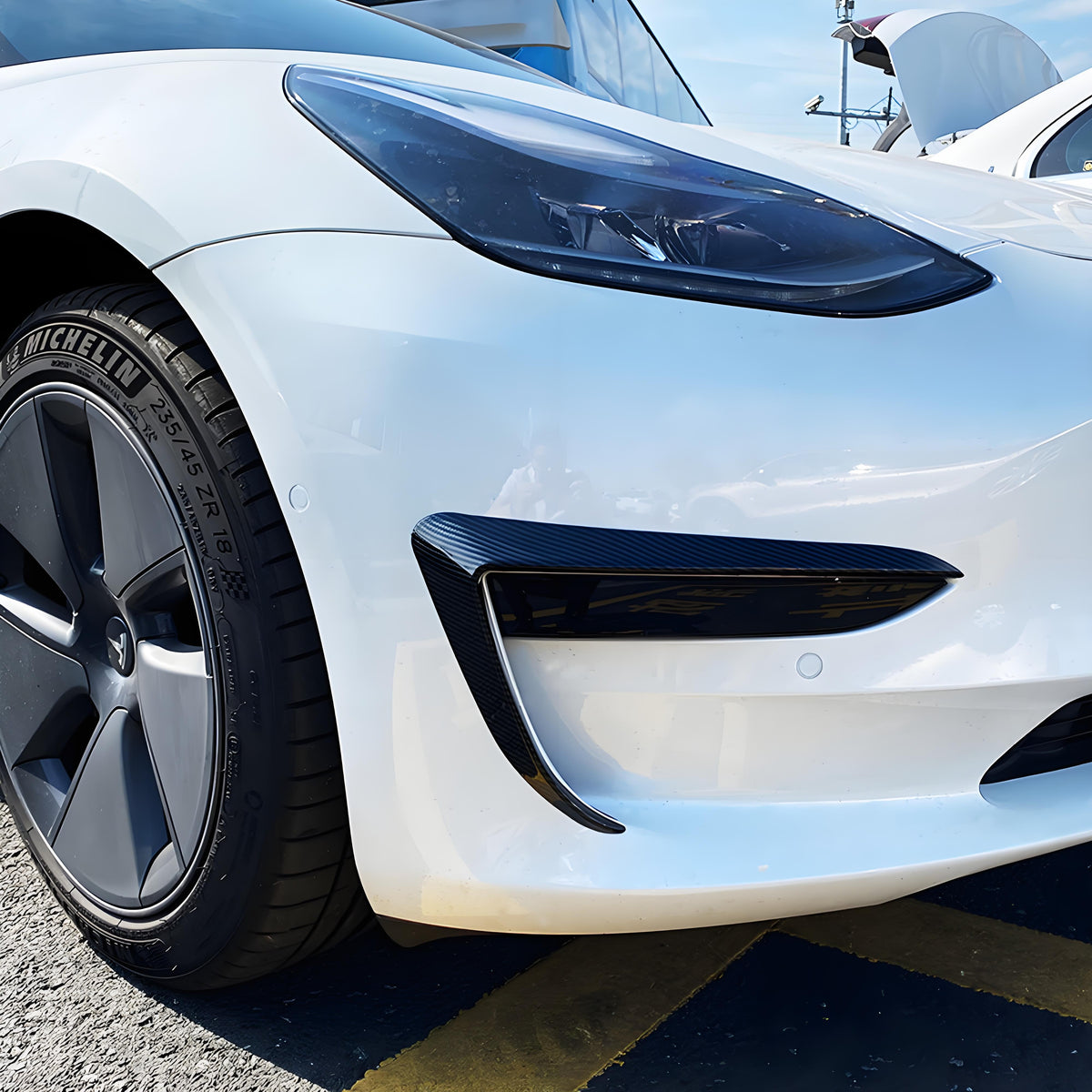 Tesla front bumper side decals installed on vehicle