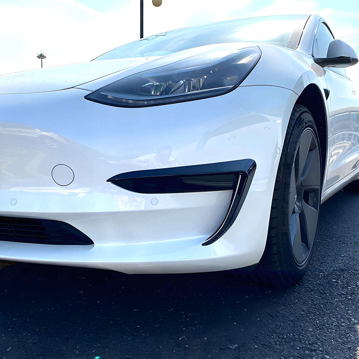 Tesla front bumper side decals installed on vehicle