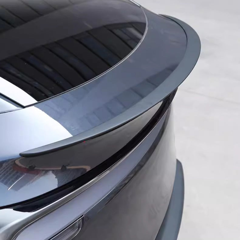 Side view of dry carbon fiber trunk spoiler for Tesla Model Y Juniper