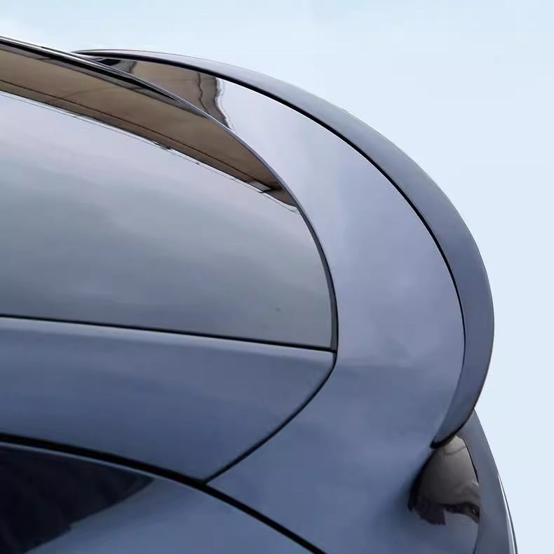 Carbon fiber weave detail on Tesla Model Y Juniper rear trunk spoiler