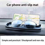 Tesla anti-skid pad holding phone and sunglasses